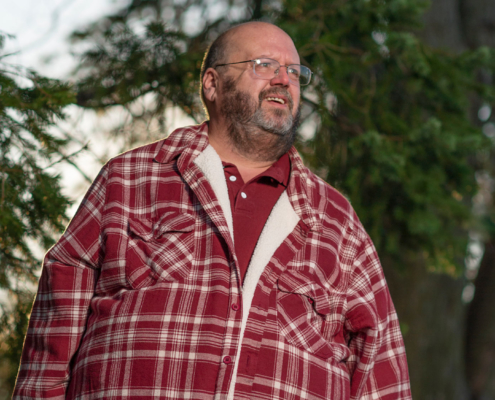 Man in red flannel shirt with beard